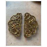 Two brass trivets