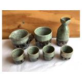 7 pc. Pottery set- cups, creamer, etc.