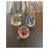 3  glass paper weights - rabbit, flower,etc.