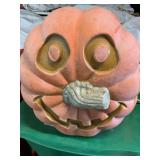 Plastic pumpkin 11" tall shows wear