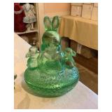 Green glass bunnies on a nest 7"h