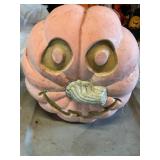 Plastic pumpkin 11" tall shows wear
