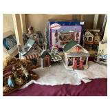 Porcelain Christmas houses, some lighted, train