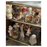 Contents of two shelves- bells, bears, figurines