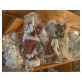 Contents of shelf 6 santas, 16" tallest