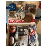 Political pins, advertising buttons in cigar box