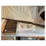 Wood/metal toy gun, Websterï¿½s dictionary, wall