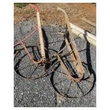 2 hand plows wood