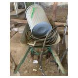 Wheelbarrow w/contents, metal trash can, hose