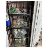 Metal shelf with gallon jars, glassware, etc.