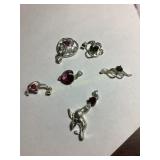 6 Small pendants, most marked 925, .34 oz.
