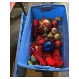 Plastic tote with Christmas ornaments, some very