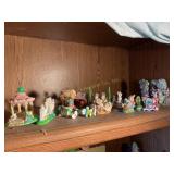 Contents of shelf- rabbit, chick figurines, etc.