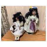 2 African American Porcelain dolls, tallest is