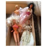 Ken doll & 3 Barbie dolls
