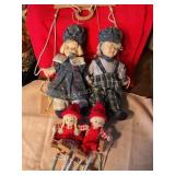 4 porcelain face dolls on swings, 7" tallest