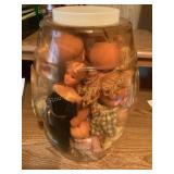 Misc.baby doll in plastic barrel container