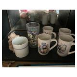 Contents of shelf- ET mug, Flintstone glass, mugs