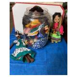 Plastic jug of dolls cloth & rubber, from