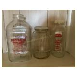 2 Glass juice bottles & barrel jar, 7"
