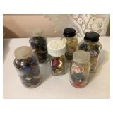 7 bottles of buttons