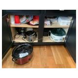 Contents of cabinet - various crockpots (Rival,