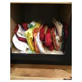 Content of one kitchen cabinet- dish towels, pot