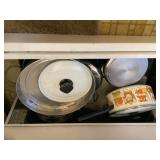 Contents of stove drawer- pots/pans, Revere, etc