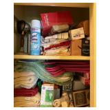 Contents 2 shelves-first aid,  towels, cleaning