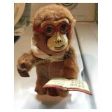Vtg wind up tin/fur litho reading monkey works! 6"