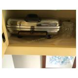 Content of cabinet shelf,  Waffle maker,jelly jars