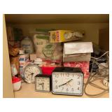 Shelf contents- cotton balls, alarm clocks-baby