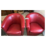 PAIR OF RED FAUX LEATHER SWIVEL BARREL CHAIRS