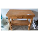 WOOD TABLE, 20 x 36, 34 INCHES TALL,ON WHEELS,