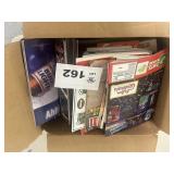 Large box of sports paper items