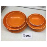 ORANGE AND WHITE TUPPERWARE BOWL SET