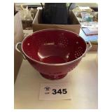 RED METAL COLANDER. NEW