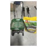 SEEDER WITH BAG OF WEED AND FEED