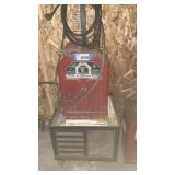 LINCOLN 225 AMP ARC WELDER WITH ROLLING STAND