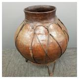 Lg handmade pottery vessel w/ rawhide trim on