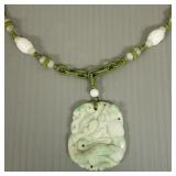 Carved jade dragon motif pendant necklace w/