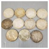 11 U.S. Peace silver dollars: six 1922, two 1923,