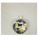 Carved amber pendant w/ sapphires in scenic