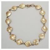 14K gold shell motif bracelet- 6.4g; 7 1/2"L
