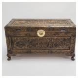 Asian carved wood trunk with dragon motif-