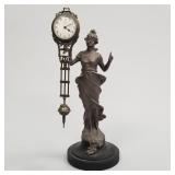 Junghans figural free swinging clock- 13 1/2"H 5"W