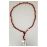 Carved carnelian bead necklace with rock crystal