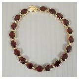 14K gold bracelet s/w garnets- 7.6g; 7"L