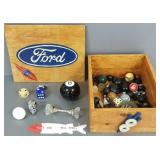 Wooden crate with auto related items, shift knobs,