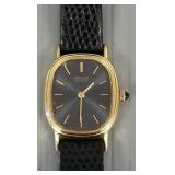 Seiko 14K gold w/ leather band & black face dial